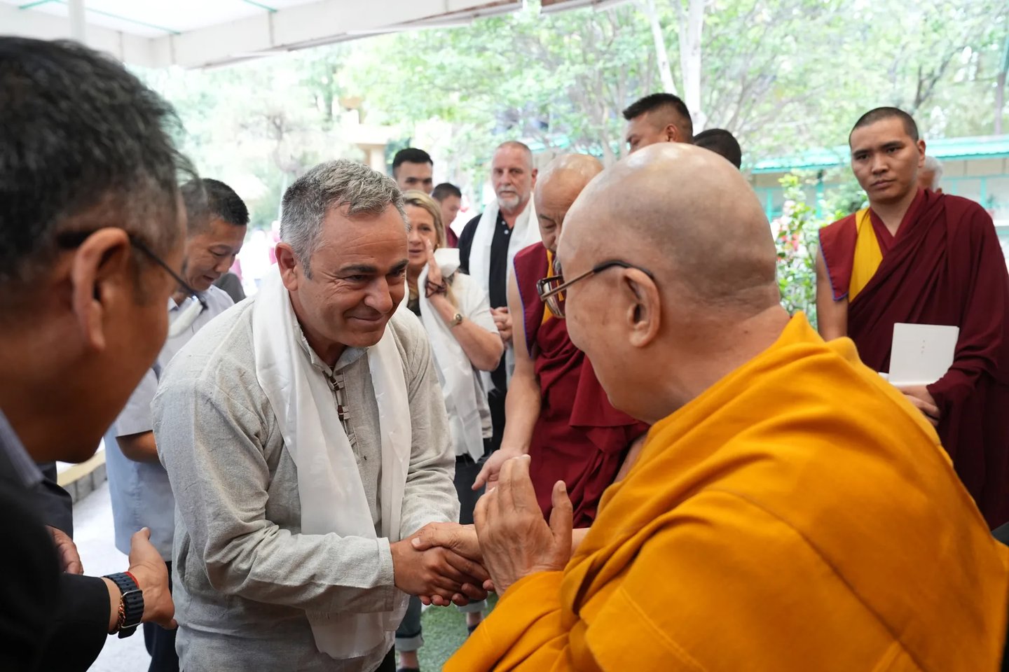 Happytalistas gathered around a shared practice with H.H. the Dalai Lama