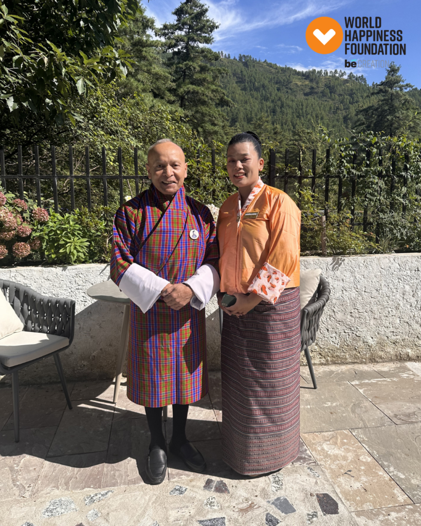 Hosts in traditional Bhutanese gho and kira